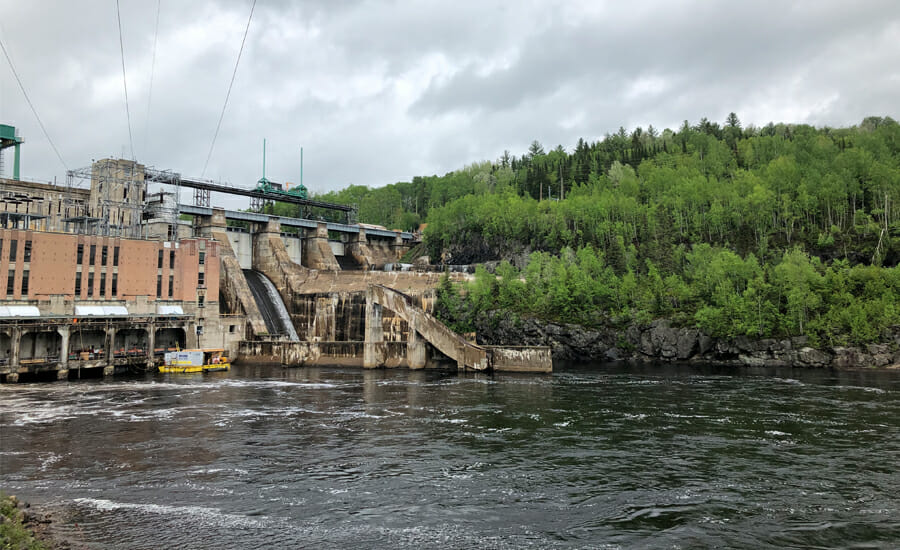 A large dam in the middle of a river.