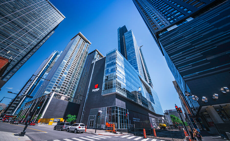 A view of a city street with tall buildings.