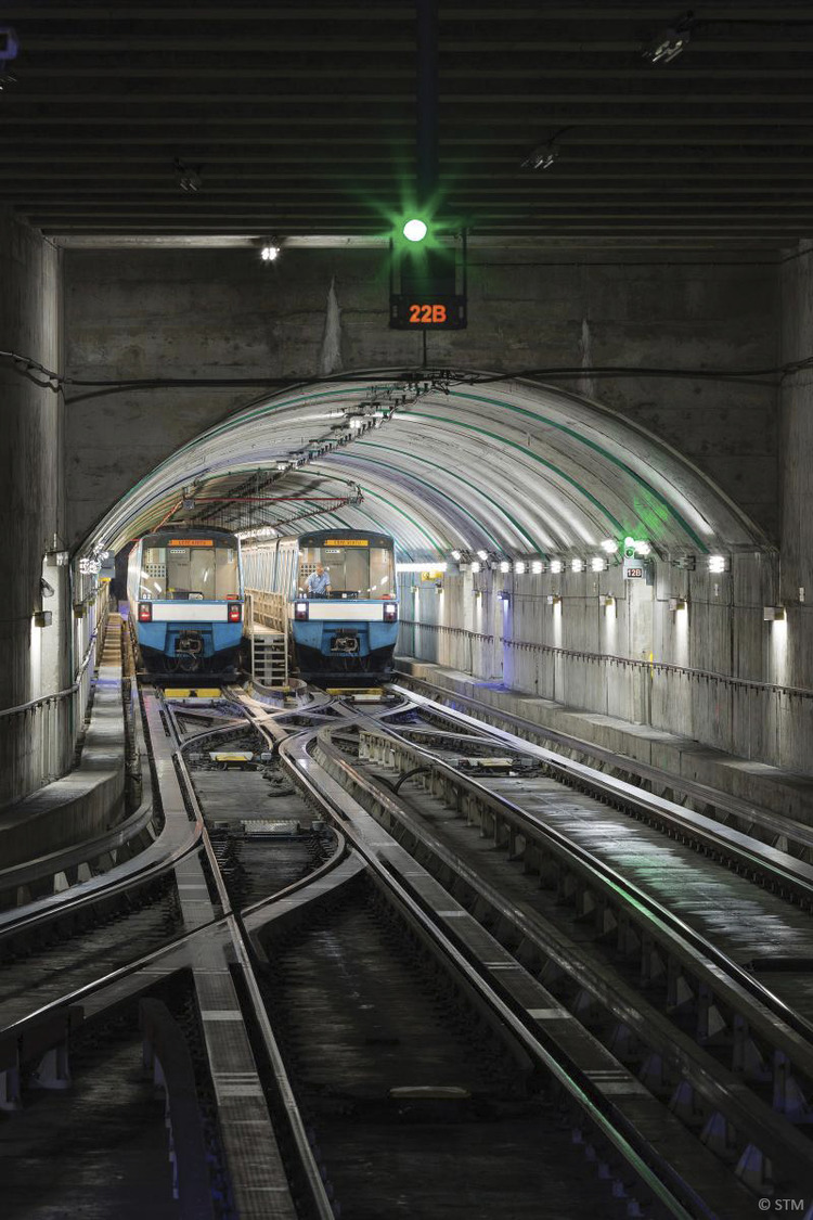 A train traveling down a track in a tunnel.