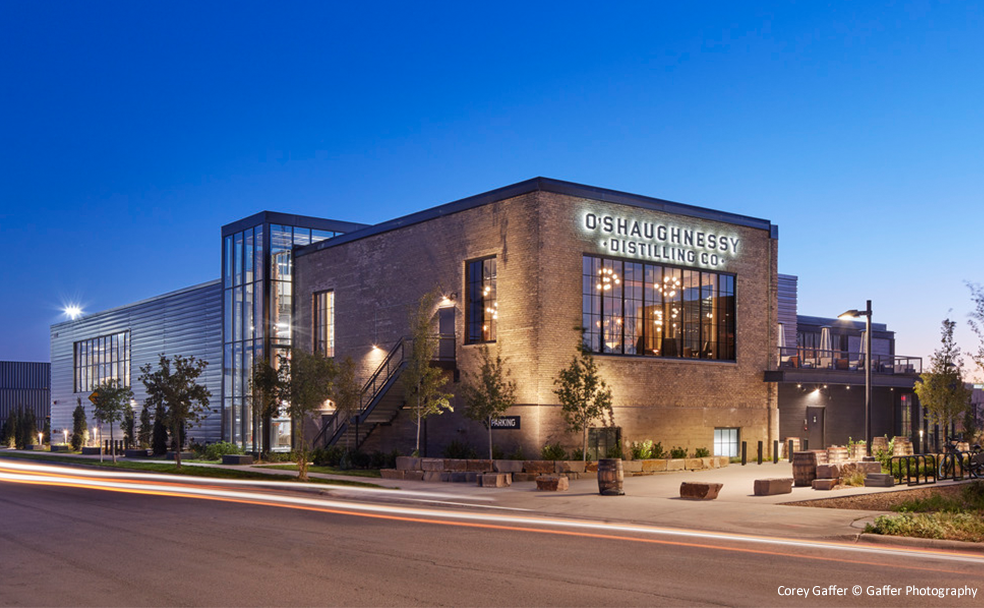 The building is lit up at dusk.