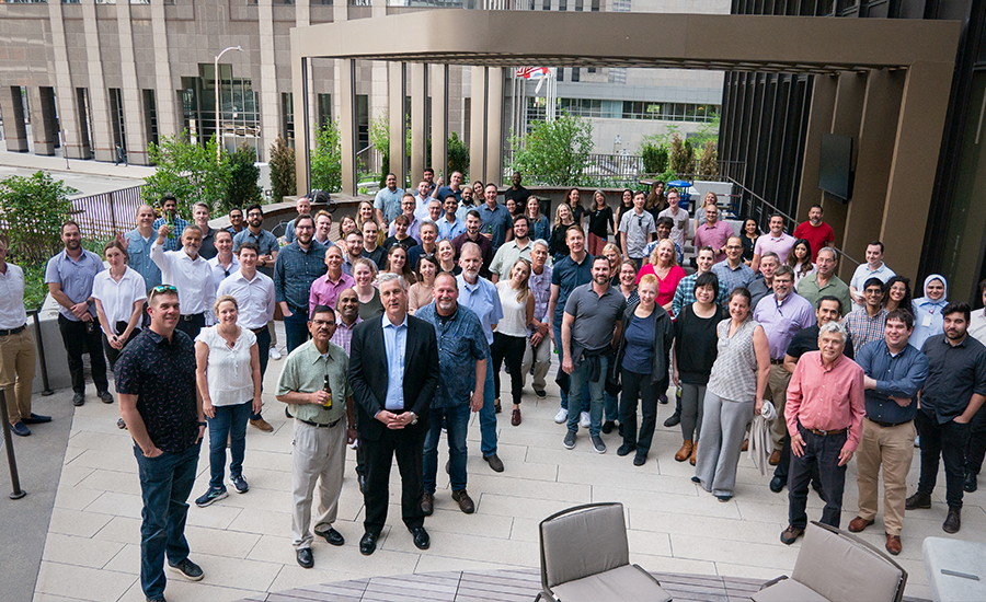 A group of people standing in front of a building.