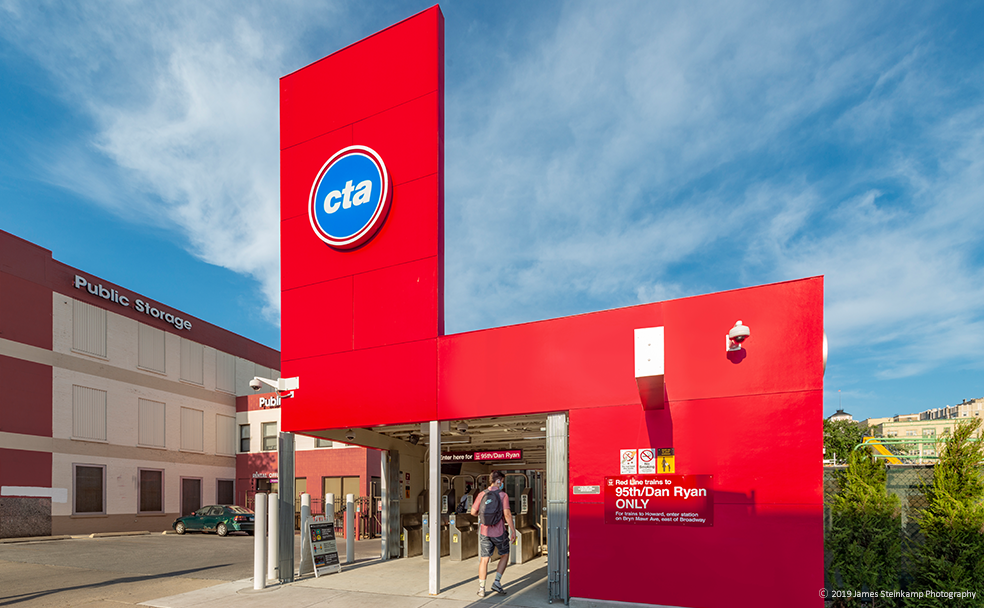 A red building with a sign on it.