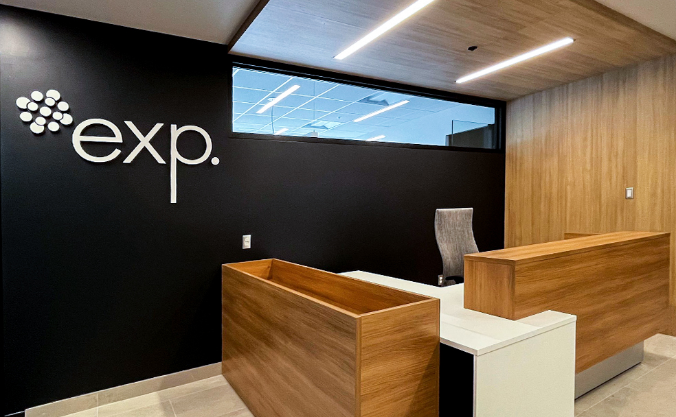 The front reception desk and EXP logo at the Sherbrooke Quebec EXP office.