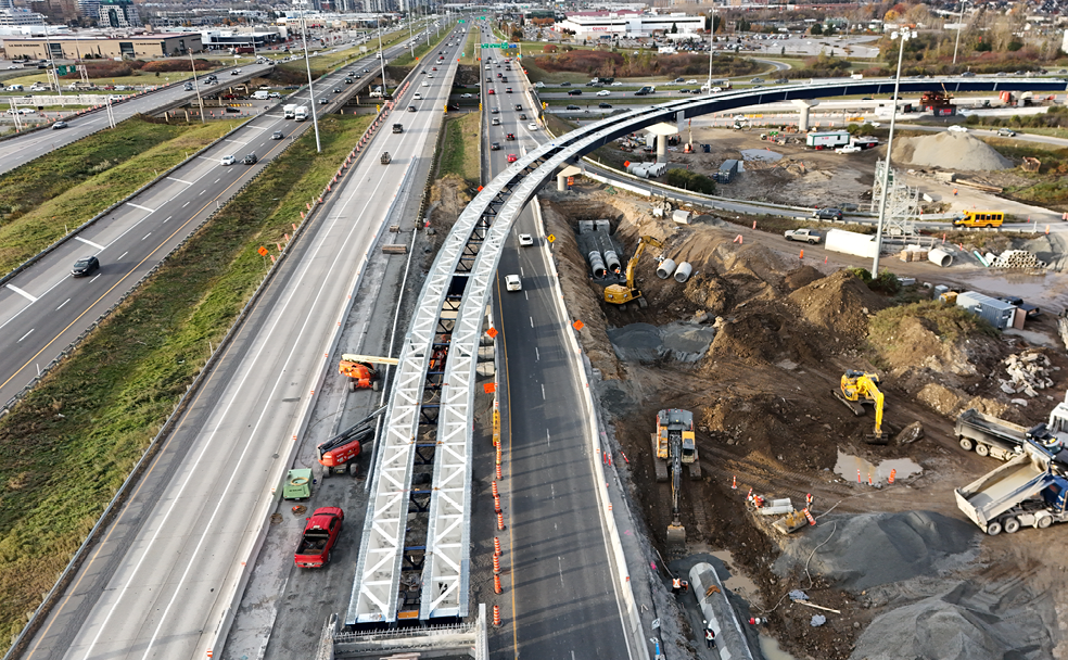 An aerial view of the construction of a bridge over a highway.