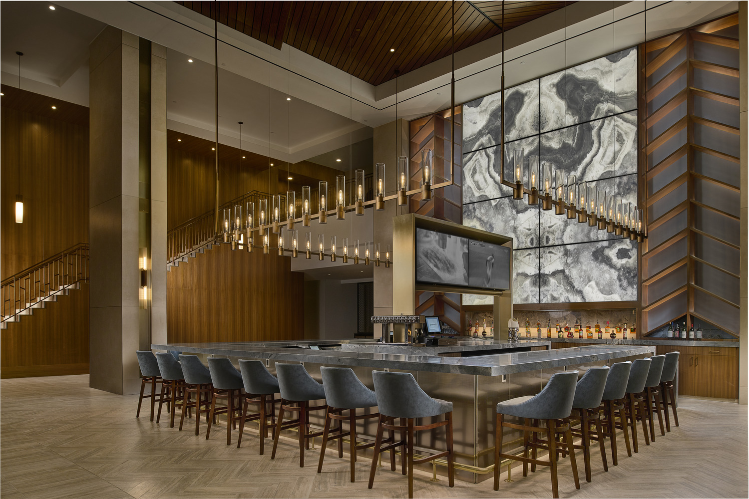 A bar with chairs and a counter.