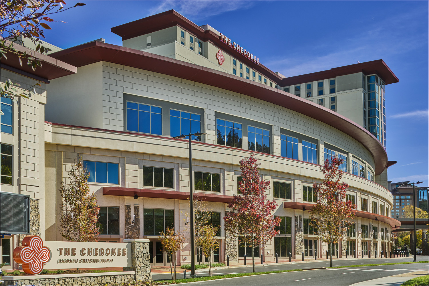 A large building with a sign in front of it.