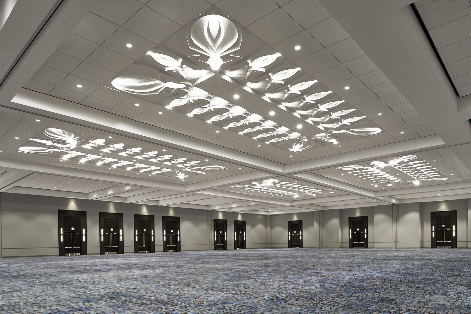 A large ballroom with blue carpet and white lights.