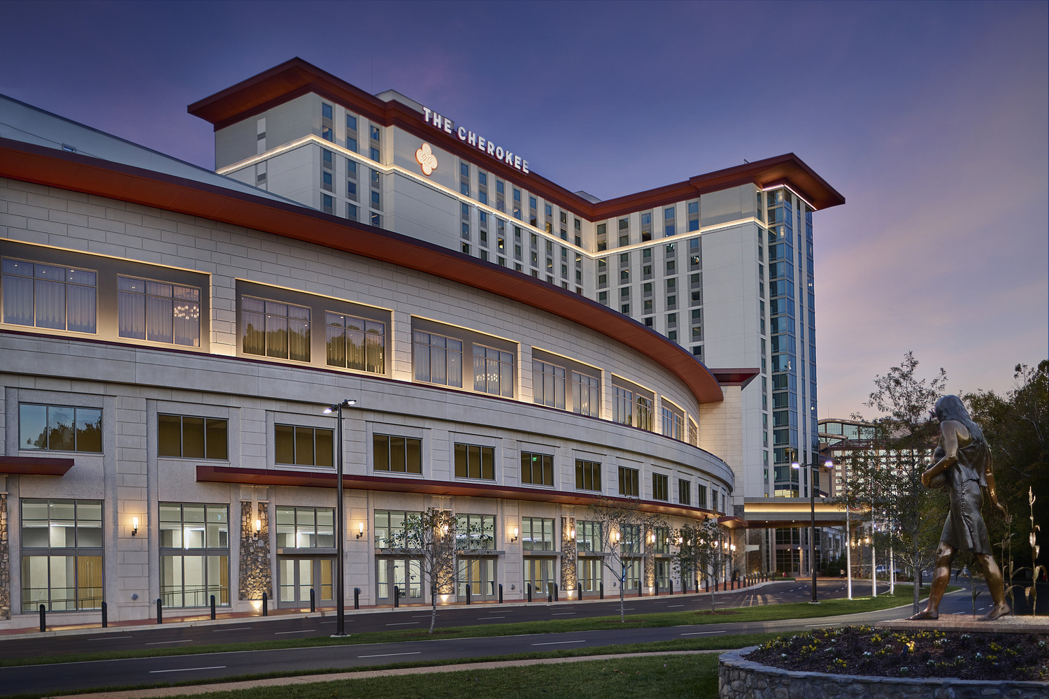 A large building with lights on.