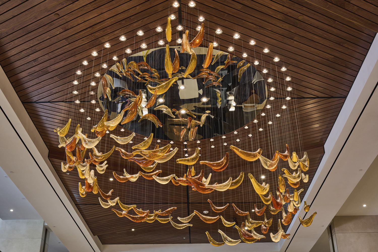 A chandelier with glass pieces from the ceiling.