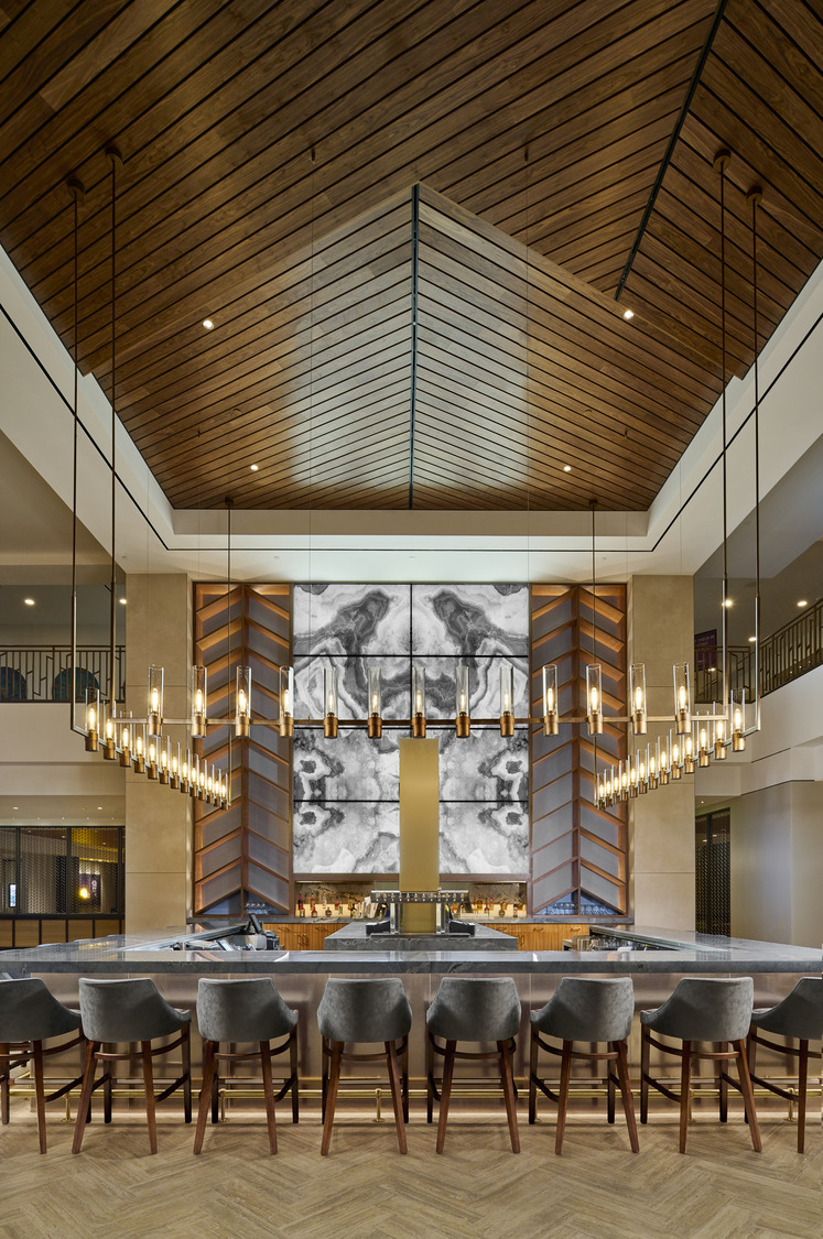 A large room with a large counter and a large chandelier.