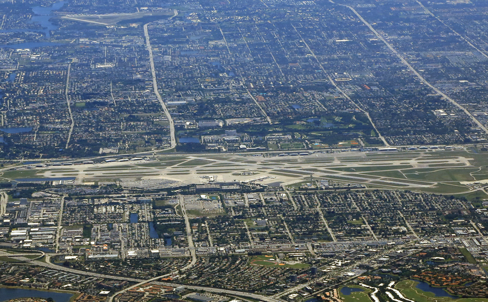 An aerial view of a city and airport.