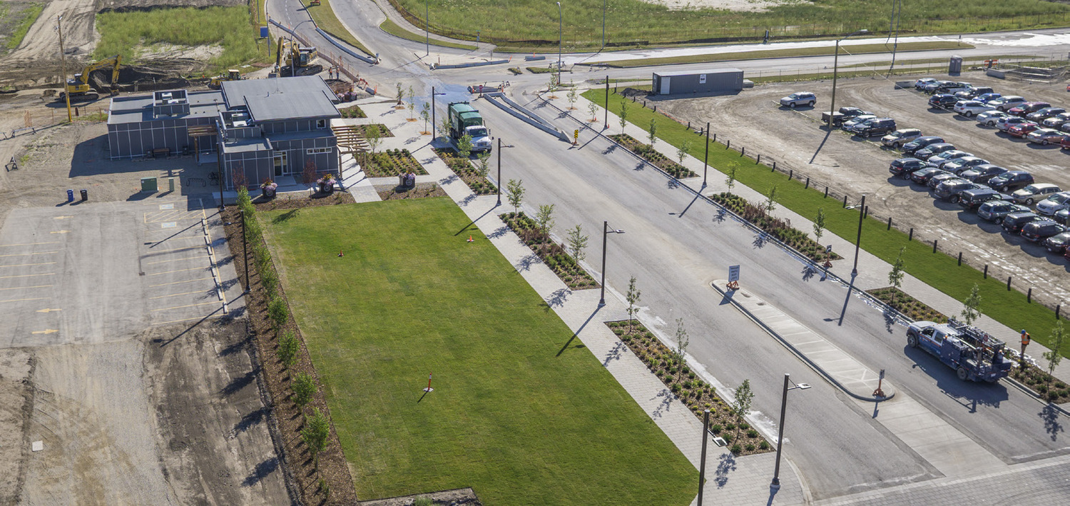 An aerial view of a parking lot with cars parked in it.