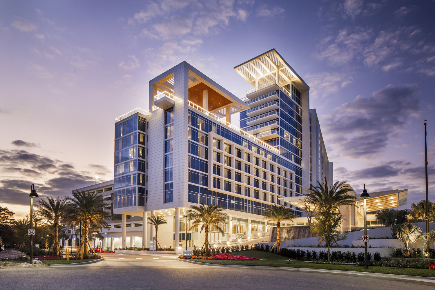 A modern hotel building at dusk.