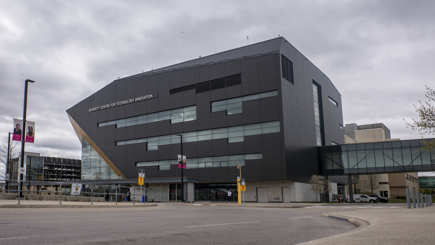 Modern museum building with angular architecture under a cloudy sky.