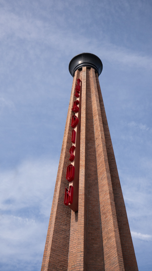 Tall brick tower with the word 
