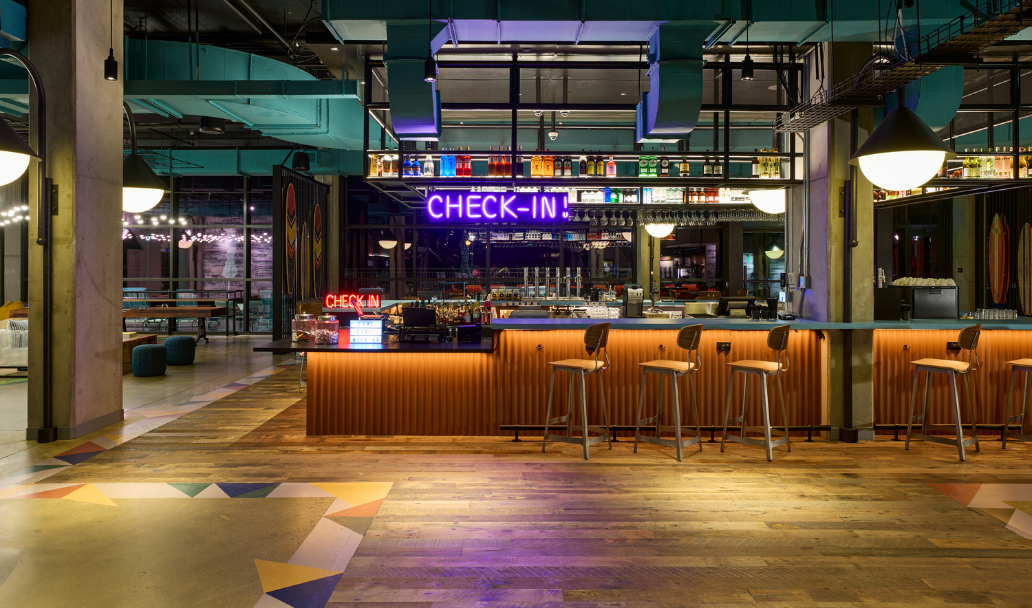 Modern hotel lobby with a neon 